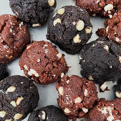 Hot Choc It Up and Midnight Snack protein cookie dough balls on a plate together