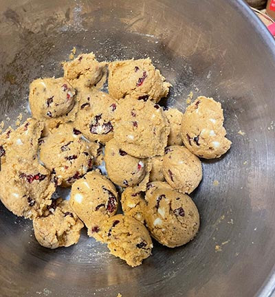 Protein cookie dough with other toppings mixed in a bowl