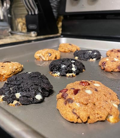 Variety of protein cookies on a baking sheet